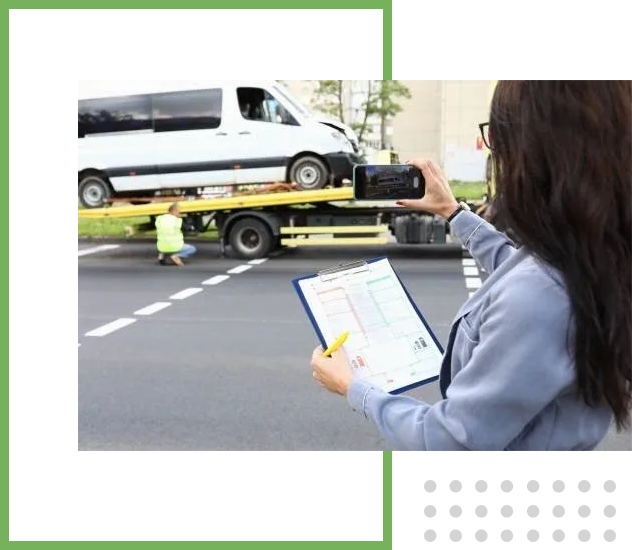 Towing Employee Taking Pictures of Breakdown Car